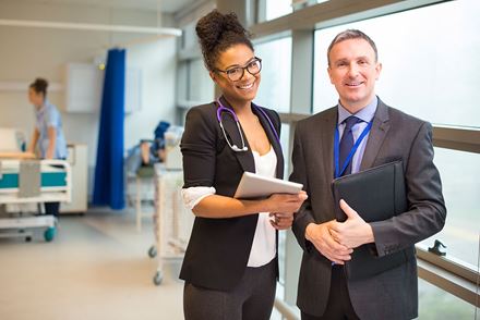 man and woman in patients room RQI request more information man and woman in patients room RQI request more information image