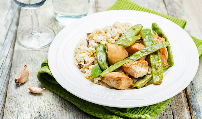 serving size on a plate chicken and snow peas