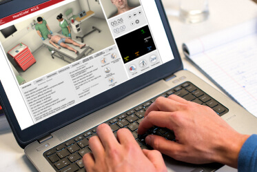 HeartCode course on laptop with hands typing on keyboard HeartCode course on laptop with hands typing on keyboard
