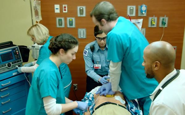 medical team working on patient in hospital