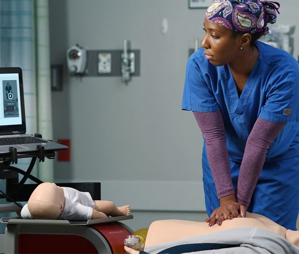 nurse practicing on RQI mobile Simulation Station