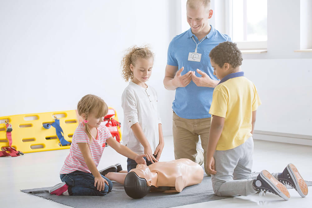 Kids Practicing First Aid