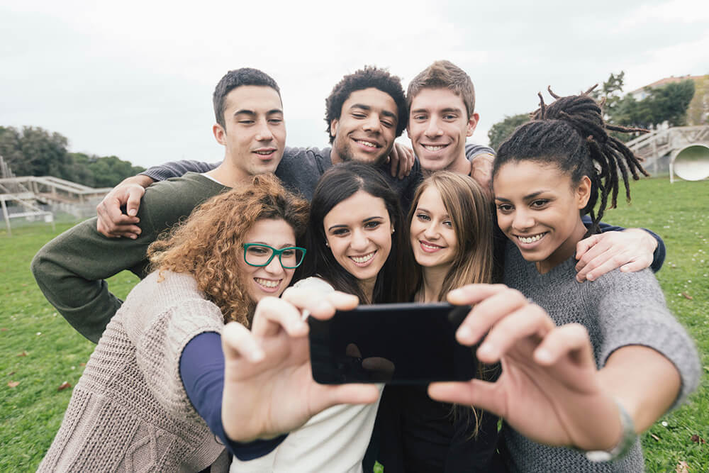 high school students posing for a selfie