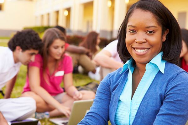 students working together outside on campus