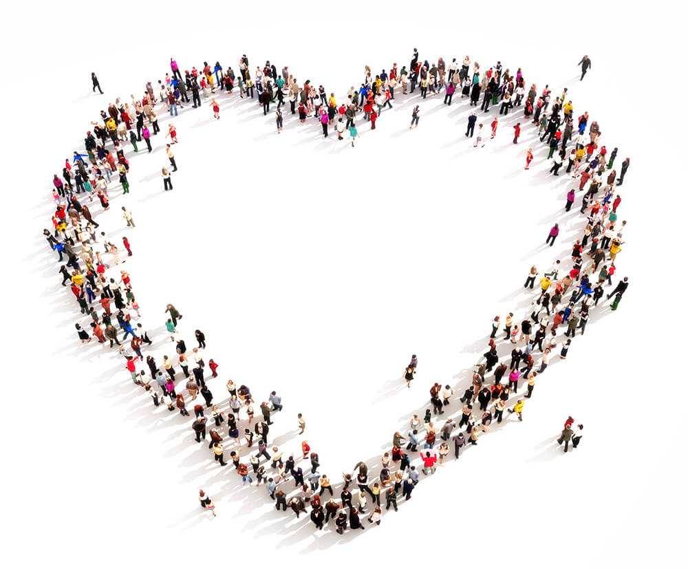 large group of people in the shape of a heart outline