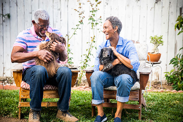happy middle-aged couple with dogs