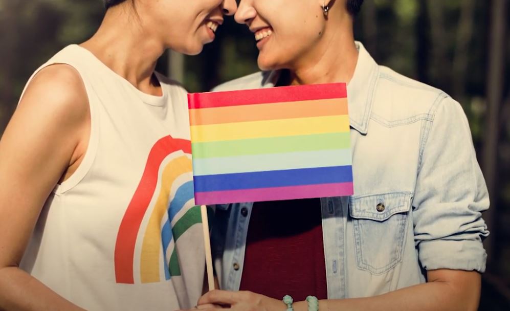 two women and a rainbow flag