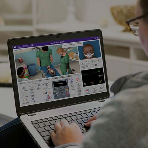woman watching cpr and ecc guidelines on laptop