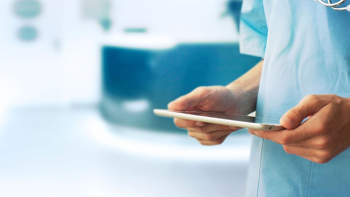 medical staff using tablet