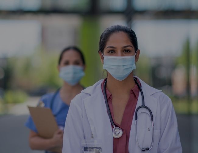 two medical staff wearing masks