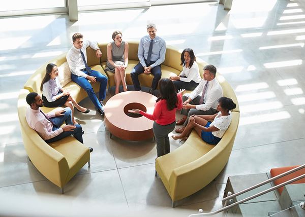 businesswoman presenting at team meeting elevated