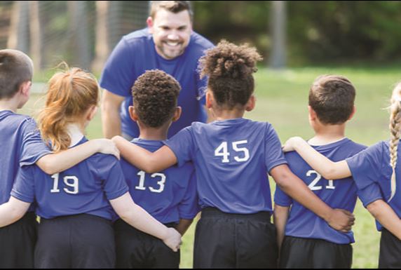 Children with a coach