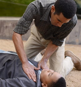 Heartsaver Pediatric man assisting a collapsed young man image