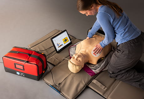 practicing CPR on a manikin