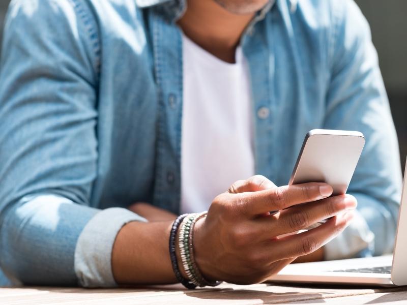 person holding a cell phone person holding a cell phone